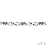 4x3mm Oval Cut Tanzanite and 1/10 Ctw Single Cut Diamond Bracelet in 10K White Gold