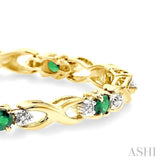 4x3 MM Oval Cut Emerald and 1/10 Ctw Single Cut Diamond Bracelet in 14K Yellow Gold