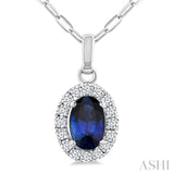 6x4 MM Oval Shape Sapphire and 1/6 Ctw Round Cut Diamond Halo Precious Pendant with Chain in 14K White Gold