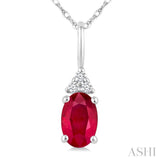 1/50 Ctw Oval Cut 6X4 MM Ruby and Round Cut Diamond Precious Pendant With Chain in 10K White Gold