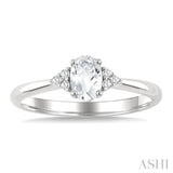 1/20 Ctw Oval Cut 6X4 MM White Topaz and Round Cut Diamond semi-precious Ring in 10K White Gold