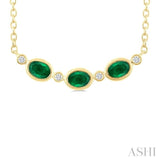 4X3MM Oval Cut Emerald and 1/50 Ctw Bezel Set Round Cut Diamond Precious Fashion Necklace in 10K Yellow Gold