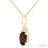 1/50 Ctw Oval Cut 6X4 MM Garnet and Round Cut Diamond Semi-Precious Pendant With Chain in 10K Yellow Gold