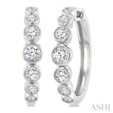 1 1/10 Ctw Graduated Bezel Set Round Cut Diamond Fashion Hoop Earrings in 14K White Gold