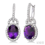 9x7mm Oval Cut Amethyst and 3/8 Ctw Round Cut Diamond Earrings in 14K White Gold