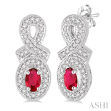 5x3 MM Oval Cut Ruby and 1/3 Ctw Round Cut Diamond Earrings in 14K White Gold