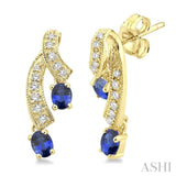4x3MM Oval Cut Sapphire and 1/5 Ctw Round Cut Diamond Earrings in 14K Yellow Gold